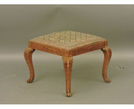 A Victorian maple stool, with a needlework drop in seat, on cabriole legs, 53cm square, 40cm high approximately