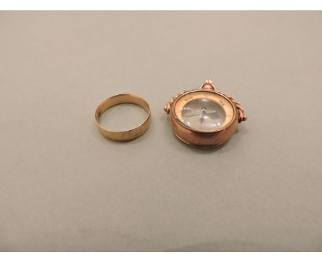 A 9ct gold swivel compass, and an 18ct gold wedding ring