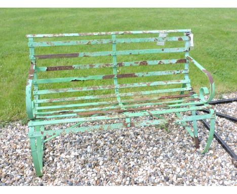 A wrought iron garden bench, painted green, 119.5cm wide