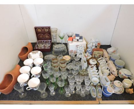A large quantity of miscellaneous ceramic and glass ware, to include porcelain porcine ornaments, etc