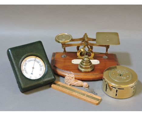 A pocket barometer, 7cm, cased, Midland Band Limited money box, 8.5cm diameter, a Battersby hat rule, 12.7cm long, a pair of 
