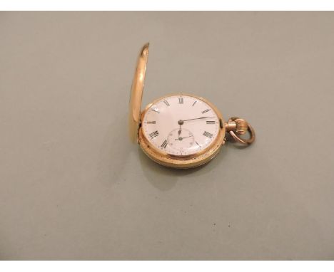 A half hunter gold pocket watch, with white enamel dial, black Roman numeral chapter ring with a seconds subsidiary dial, eng