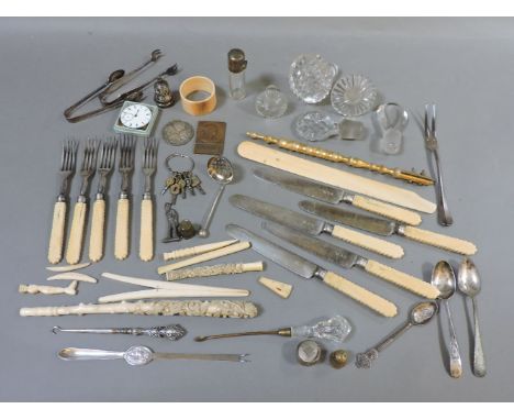 An ivory handled cutlery, parasol handle, glass stoppers, pipe tamper, cutlery, etc