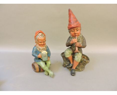 A mid 20th century Heissner terracotta gnome, enjoying a tipple, 28cm high, together with a further Heissner terracotta gnome