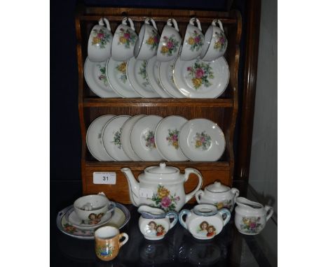 A VINTAGE PART DOLL'S TEA SET decorated with portraits of the princesses Elizabeth and Margaret, a rose decorated doll's tea 