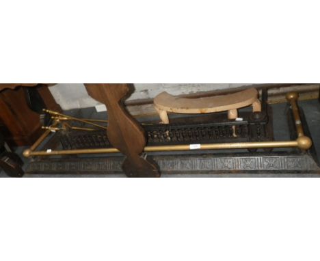 A VICTORIAN FENDER with brass rail, another fender and a set of brass fireplace tools