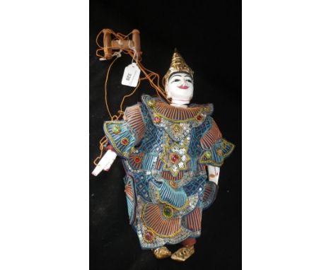 AN EASTERN PUPPET in decorated costume