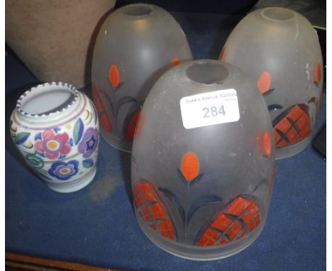 THREE PAINTED FROSTED GLASS LAMP SHADES and a small Poole Pottery vase