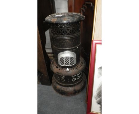 A VINTAGE ENAMELLED TIN 'VALOR' OIL HEATER with instructions leaflet