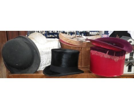 A VINTAGE TOP HAT in leather case and a bowler hat 
