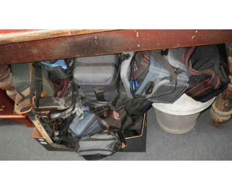 A COLLECTION OF CAMERA BAGS