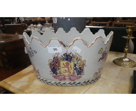 AN ORIENTAL STYLE CERAMIC JARDINIERE decorated with armorials