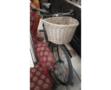 A LADIES VINTAGE BICYCLE with wicker basket