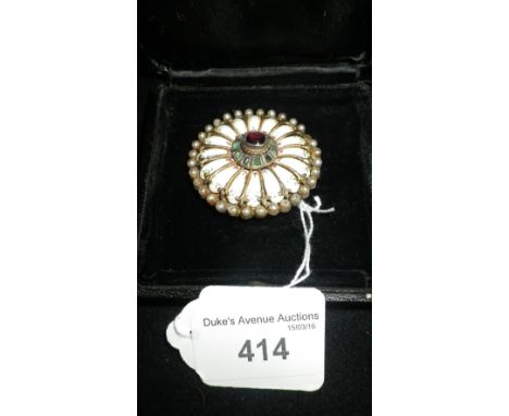 A WHITE METAL AND CERAMIC BROOCH edged with seed pearls