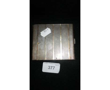 A SILVER CIGARETTE CASE with engine-turned decoration