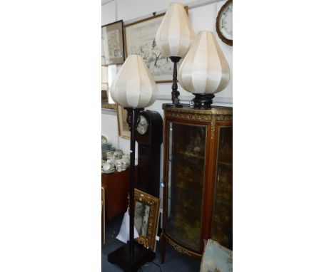 AN ORIENTAL TABLE LAMP WITH SHAPED SILK SHADE, another similar and a matching standard lamp