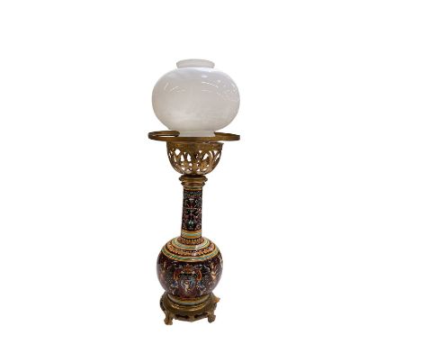 An early 20th century Italian majolica type porcelain oil lamp, with gilt metal mounts and whtie glass shade, height 65cm.