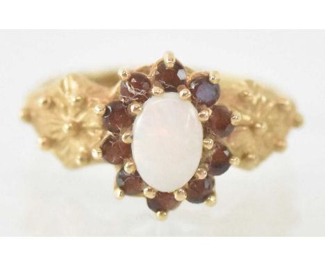 A 9ct yellow gold opal and garnet set ring, size O, approx 3.2g.