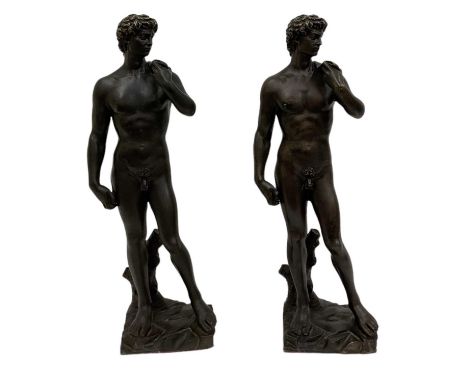 AFTER MICHELANGELO; a pair of reproduction bronze figures of 'David', both height 61cm.