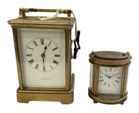 H GREAVES; a brass cased carriage clock, the white enamel dial set with Roman numerals and stamped 'H Greaves of Birmingham',
