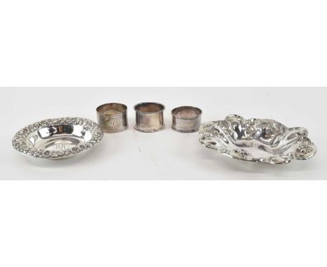 BARBOUR SILVER CO; a silver dish with floral decorated border, 14.5 x 12cm, a sterling silver circular dish with floral decor