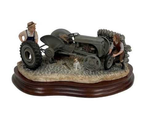 BORDER FINE ARTS; a model of a tractor, 'Changing Times', model no. B0912, height 13cm, on wooden base, boxed.