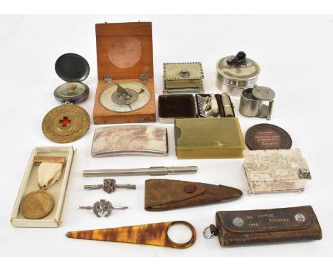 A quantity of collectors' items including compass, silver plated card case, trinket box, military cap badge, magnifying glass
