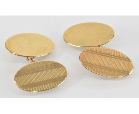 A pair of 9ct yellow gold oval cufflinks, with engine turned decoration, combined approx 5g.