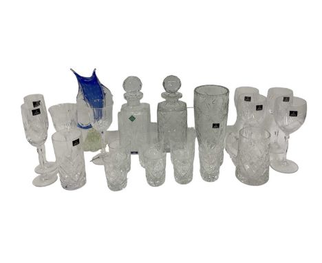 A large quantity of crystal glassware including two Edinburgh Crystal decanters, both height 15cm, a set of four Royal Doulto