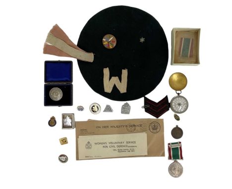 A collection of Women's Voluntary Service items including a Service Beyond Self medal, Tottenham County Schools badge, furthe