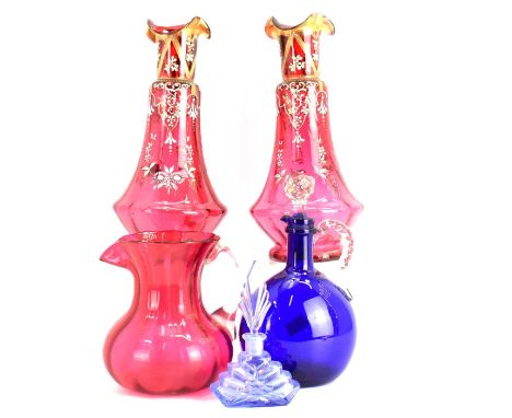 A pair of Victorian cranberry glass vases with frilled rim, the body with coloured enamelled floral decoration, height 29cm, 