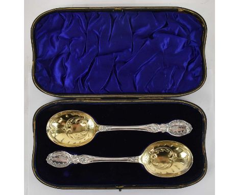 WILLIAM HUTTON &amp; SONS LTD; a cased pair of late Victorian hallmarked silver serving spoons, London 1899, length 22cm, com