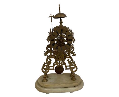 A late 19th/early 20th century brass skeleton clock, on oval marble base, height to top of finial 54cm.
