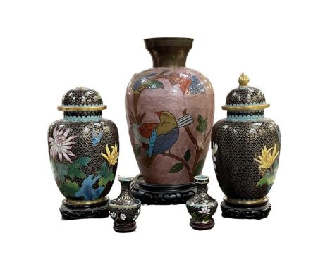 A pair of modern Chinese cloisonné enamel lidded urns, on carved hardwood stands, height 23cm, a pair of miniature cloisonné 