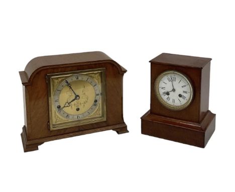An early 20th century Art Deco style walnut cased mantel clock, the gilt metal silvered dial set with Roman numerals, inscrib