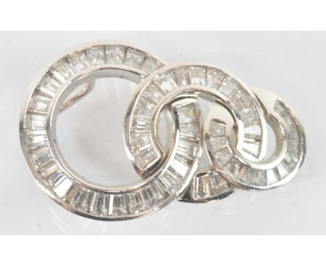 A white metal and white stone set Art Deco style three tier circular drop pendant, height 3cm, width 1.7cm, approx 5.7g.