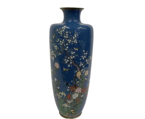An early 20th century Chinese cloisonné enamel gilt metal vase, decorated with birds amongst scrolling foliage and landscape,