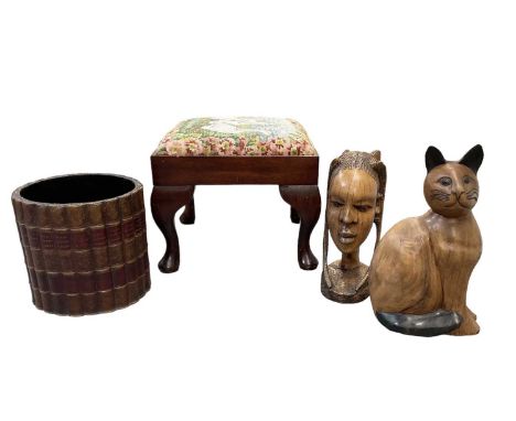 A modern mahogany framed tapestry topped footstool on cabriole legs, a hardwood carving of a cat, height 33cm, an African har