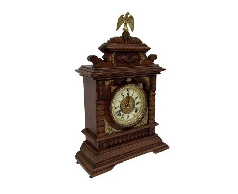 ANSONIA CLOCK COMPANY, NEW YORK; an early 20th century oak and gilt metal mounted mantel clock, the white enamel dial set wit