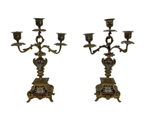 A pair of gilt metal and cloisonné enamel three branch candelabra, height 31.5cm.