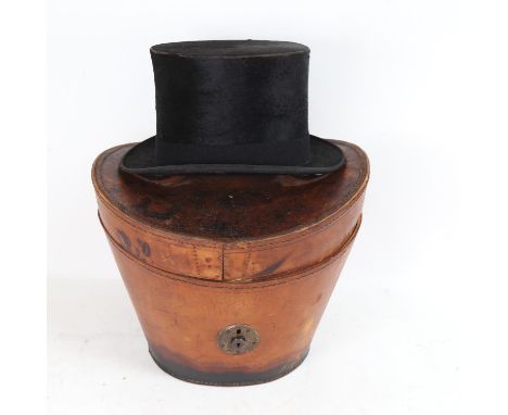 A Vintage black top hat by Battersby &amp; Co, in leather carrying case 