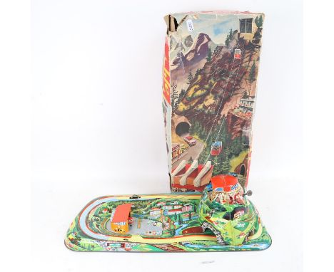 A Vintage German Technofix lithographed tinplate clockwork model 303 cable car toy, boxed 