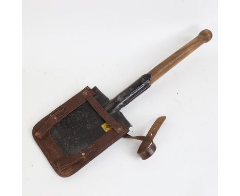 A Second World War British Army German-Pattern trench shovel, with original leather cover and broad arrow stamp, length 56cm 