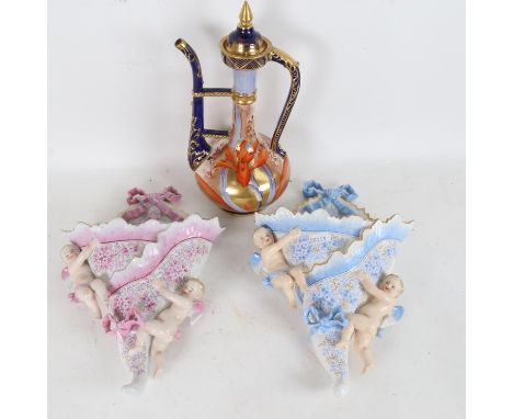 A Foley faience painted and gilded porcelain ewer, and a pair of Continental porcelain cherub wall pockets, ewer height 28cm 