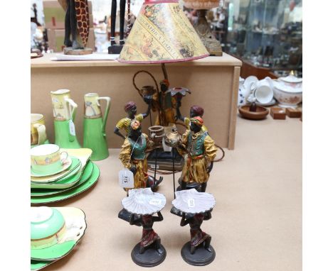 A pair of painted cast-metal Blackamoor candlesticks (A/F), a composition table lamp, height 47cm, and 2 other pairs of figur