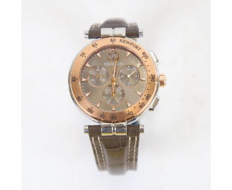 HERBELIN - a rose gold-plated stainless steel Newport quartz chronograph wristwatch, 3 subsidiary dials with date apertures, 