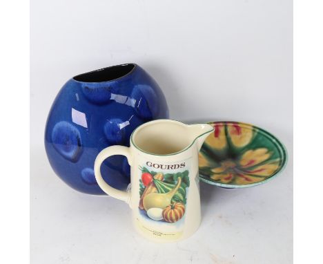 A Poole Pottery yellow flower dish, and a Poole Pottery Seed Packets jug, height 14cm (2) 