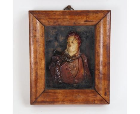 A 19th century relief moulded wax portrait, depicting a gentleman, framed, overall 18cm x 15cm 