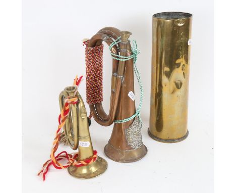 A coppery military horn, with Argyll &amp; Sutherland badge, brass bugle and cannon shell, largest height 29cm (3) 