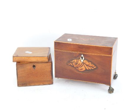 An inlaid mahogany Antique tea caddy, on claw and ball feet, L18cm, and a mahogany box 